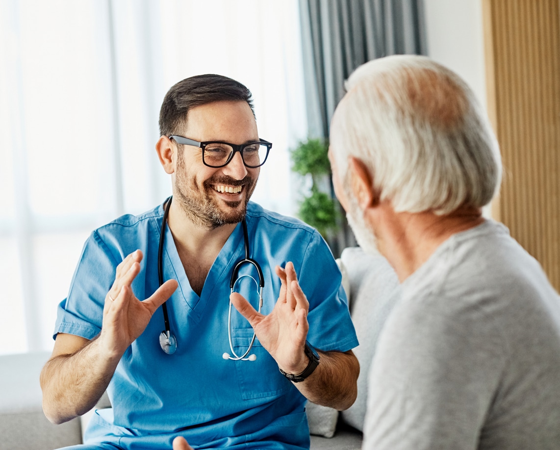 nurse doctor senior care caregiver help assistance retirement home nursing elderly health support man happy talking conversation help